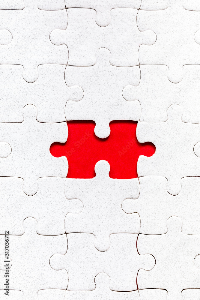 White jigsaw puzzle. White puzzle pieces on color background. Unfinished white jigsaw puzzle pieces on color background. White jigsaw puzzle. White puzzle pieces on color background. Unfinished white jigsaw puzzle pieces on color background.