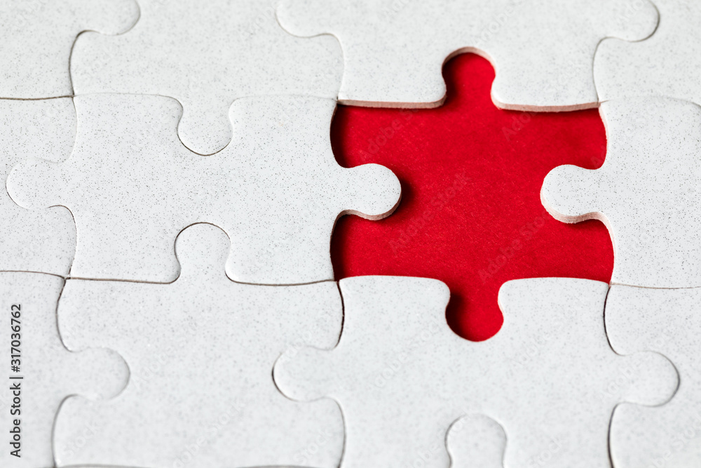 Jigsaw puzzle with missing piece. Missing puzzle pieces. Concept image of unfinished task. Completing final task, missing jigsaw puzzle pieces and business concept with a puzzle piece missing. Jigsaw puzzle with missing piece. Missing puzzle pieces. Concept image of unfinished task. Completing final task, missing jigsaw puzzle pieces and business concept with a puzzle piece missing.