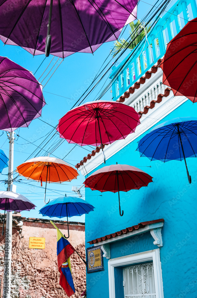 Umbrellas hanging at a street corner in Cartagena, Colombia