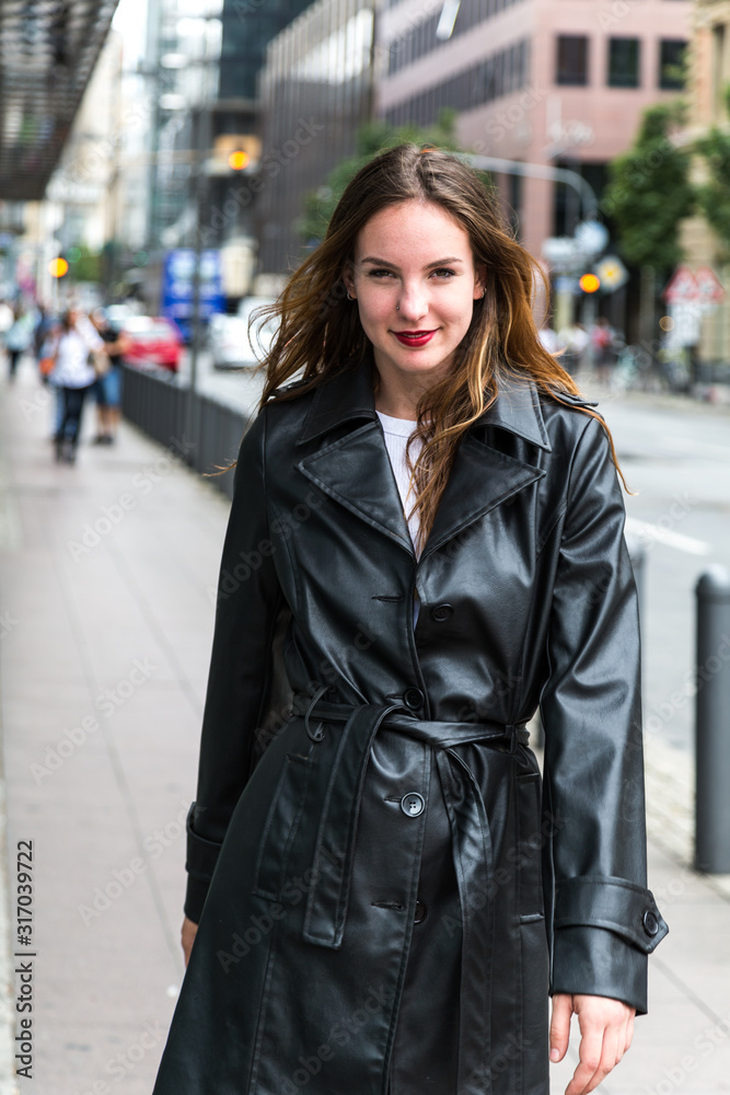 Attractive Young Woman in Black Trench Coat Attractive Young Woman in Black Trench Coat