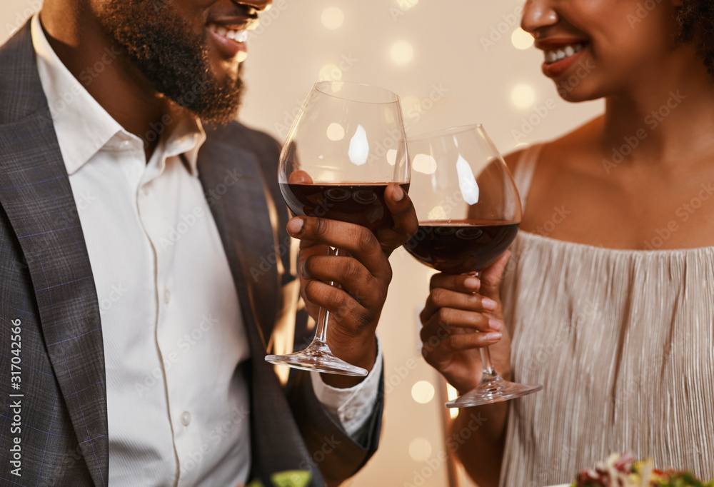 Man and woman looking at each other and toasting