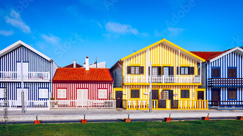 Street with colorful houses in Costa Nova, Aveiro, Portugal. Street with striped houses, Costa Nova, Aveiro, Portugal. Facades of colorful houses in Costa Nova, Aveiro, Portugal.