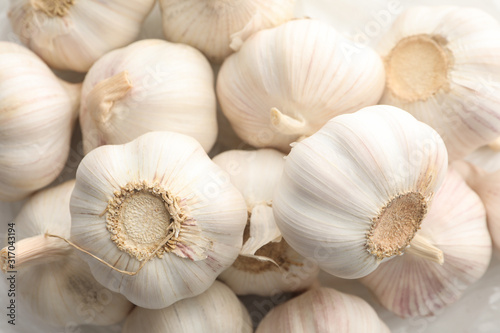 Fresh garlic bulbs textured background, close up