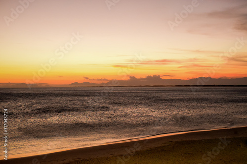 sunset on the beach © DMalta