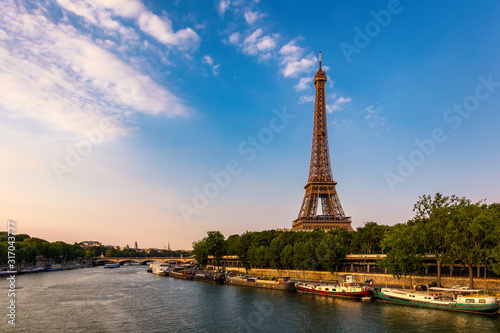 Paris Eiffel Tower and river Seine at sunset in Paris, France. Eiffel Tower is one of the most iconic landmarks of Paris. Eiffel tower in summer, Paris, France. The Eiffel Tower in Paris, France. © daliu