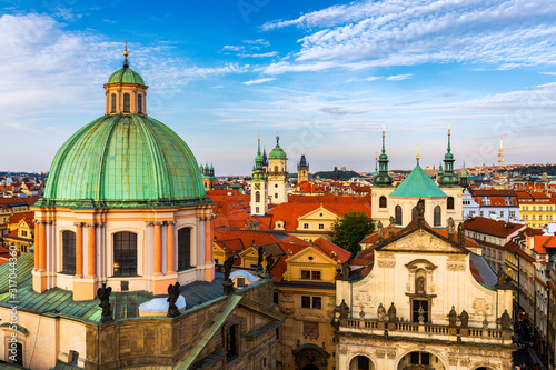 Scenic summer aerial panorama of the Old Town architecture in Prague, Czech Republic. Red roof tiles panorama of Prague old town. Prague Old Town Square houses with traditional red roofs. Czechia.