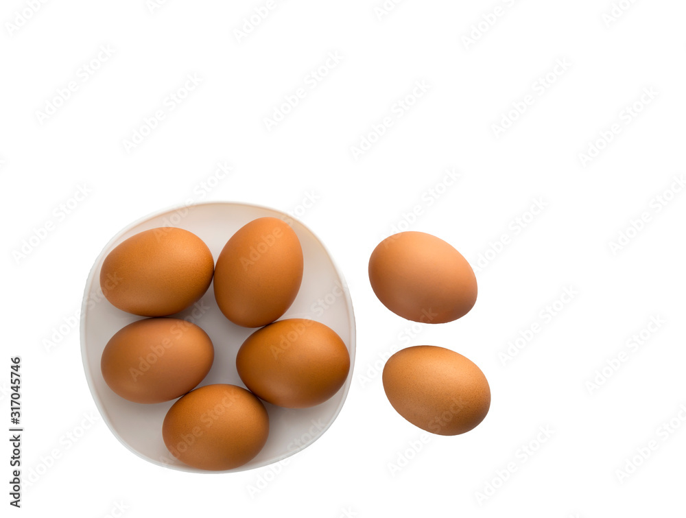 Eggs placed in a woven wooden basket.