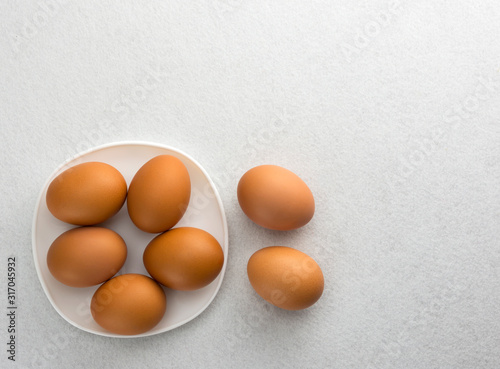 Eggs in a white plate and then lay on the floor.