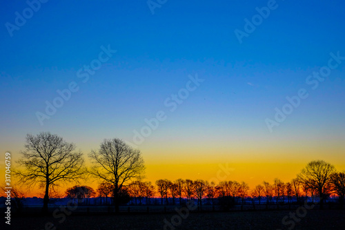 Countryside Landscape Under Scenic Colorful and dramatic Sky At Sunset or sunrise 