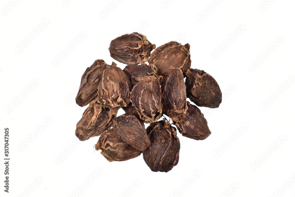 stack of black cardamom isolated on white background with clipping path, top view stack of black cardamom isolated on white background with clipping path, top view