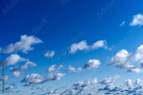Cumulus clouds in the blue sky, sunny day