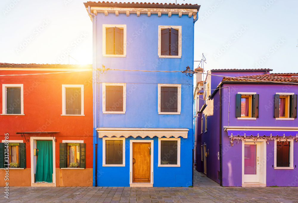 Lovely house facade and colorful walls in Burano, Venice. Burano island canal, colorful houses and boats, Venice landmark, Italy. Europe
