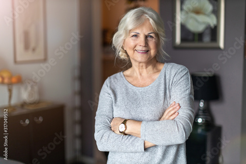 Obraz na plátně Smiling senior woman in her home