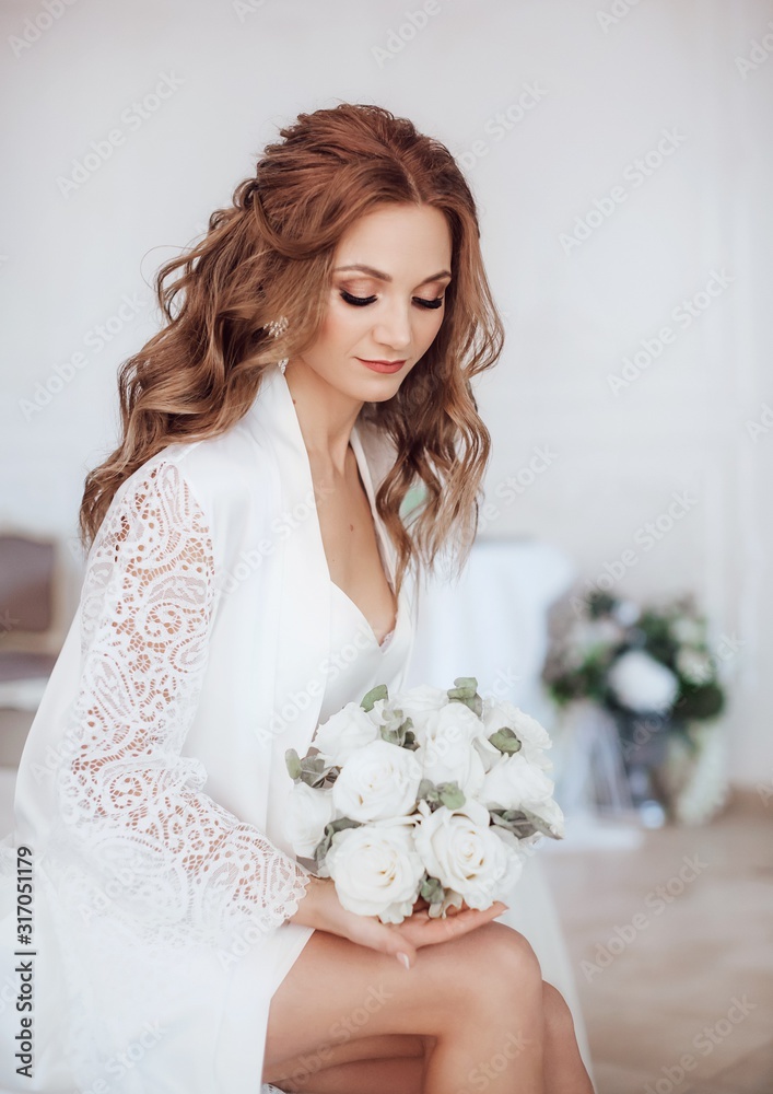 Beautiful bride with stylish make-up in white dress.Morning bride Beautiful bride with stylish make-up in white dress.Morning bride