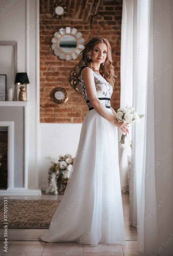 Fototapeta premium Beautiful bride with stylish make-up in white dress