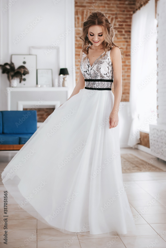 Beautiful bride with stylish make-up in white dress Beautiful bride with stylish make-up in white dress