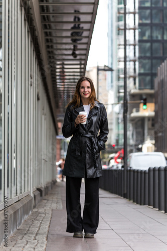 Portrait of Woman Holding Coffee Cup on City Street