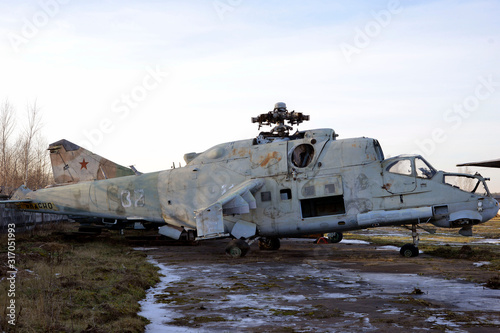 old broken military helicopter without blades and glasses