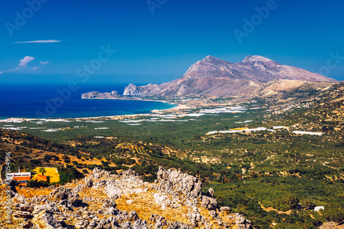 Fototapeta Naklejka Na Ścianę i Meble -  Shot of beautiful turquoise beach Falasarna (Falassarna) in Crete, Greece. View of famous paradise sandy deep turquoise beach of Falasarna (Phalasarna) in North West, Crete island, Greece.