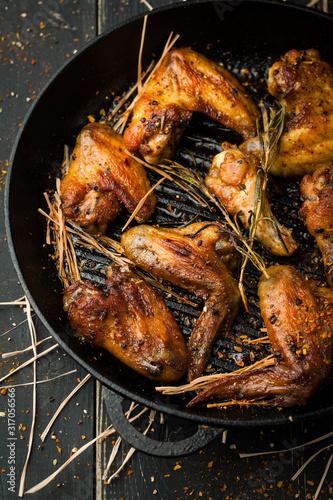 Grilled chicken wings with spices and rosemary