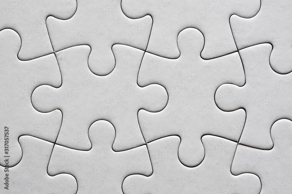 Close up on blank, white jigsaw puzzle texture Close up on blank, white jigsaw puzzle texture