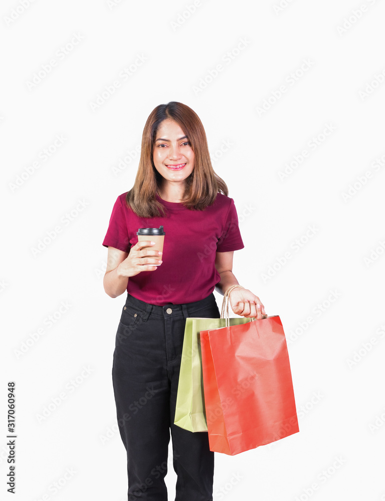 woman pretty smiling holding paper bags and Coffee carton cup in shopping. on white background and look at camera woman pretty smiling holding paper bags and Coffee carton cup in shopping. on white background and look at camera