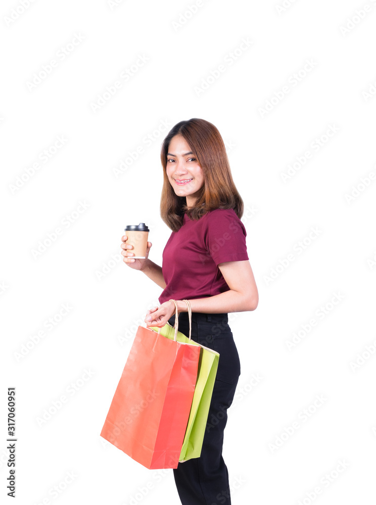 woman pretty smiling holding paper bags and Coffee carton cup in shopping. on white background and look at camera woman pretty smiling holding paper bags and Coffee carton cup in shopping. on white background and look at camera