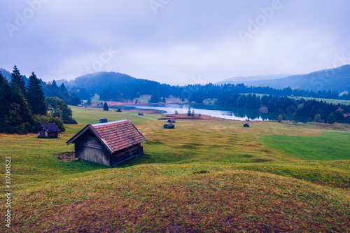 View from flying drone. Astonishing evening view of Wagenbruchsee (Geroldsee) lake with Westliche Karwendelspitze mountain range on background, Bavarian Alps, Germany, Europe. photo