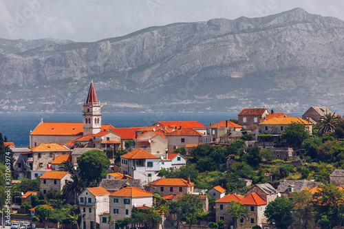 Fototapeta Naklejka Na Ścianę i Meble -  Postira on Brac island skyline view, Dalmatia, Croatia. Postira on Brac island skyline view, Dalmatia, Croatia. Gorgeous view on village Postira on Brac island, Croatia.
