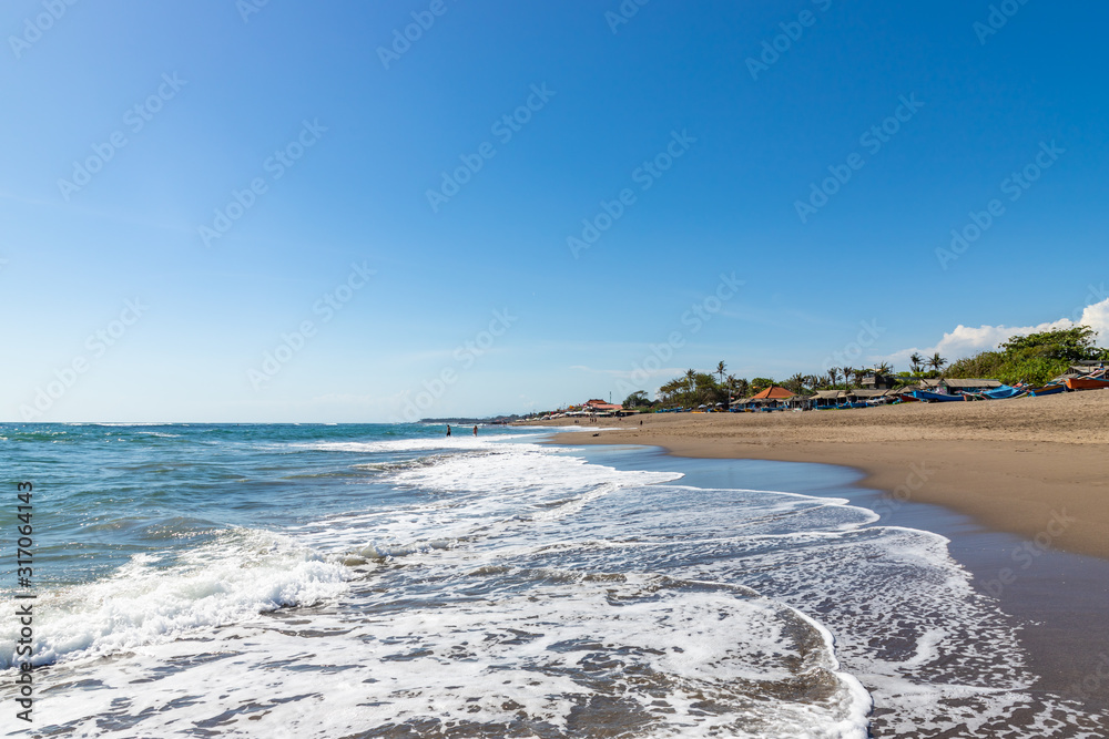 Berawa beach (Pantai Berawa) in Canggu. Wide sandy beach in sunny day. Bali island, Indonesia Berawa beach (Pantai Berawa) in Canggu. Wide sandy beach in sunny day. Bali island, Indonesia