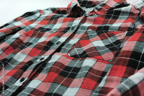 Plaid shirt with tartan checked pattern. Flannel red, black, gray and white long sleeve shirt, lifestyle clothing concept, shopping item 
