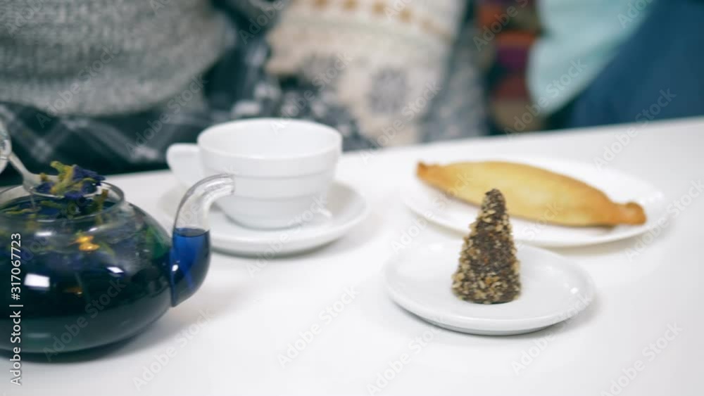 blue tea from the flowers klitoria in teapot. fashionable design food blue tea from the flowers klitoria in teapot. fashionable design food
