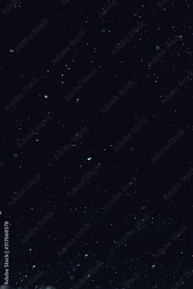 Fototapeta premium Snow bokeh in the evening, beautiful texture.