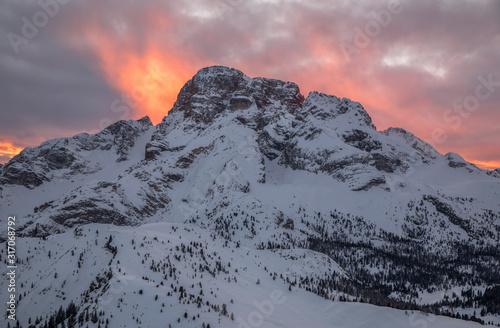 Fiery sunset behind the Croda Rossa on the upland of Prato Piazza, Braies, dolomites, Trentino Alto Adige, Italy, Europe