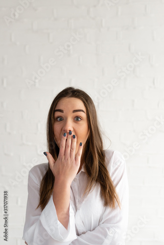 Omg  the girl is very surprised and covers her mouth with one hand  surprised