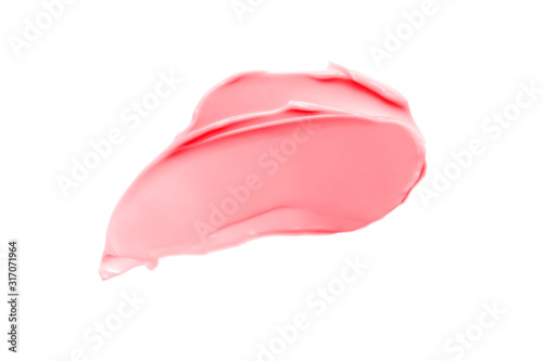 Beautiful delicate pink smear of BB face cream on a white background isolated. Tonal Foundation is smudged. Products for makeup and skin care. Organic cosmetics. Cosmetology. Closeup.