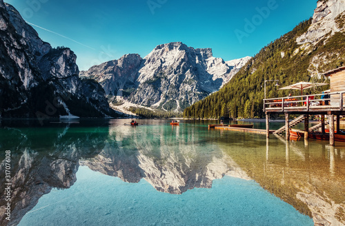 Braies lake during sunrise, popular Touristic Place in Dolomites Alps. Italy Picture of wild area Europe. Wonderful nature Landscape © jenyateua