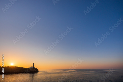 Portocolom lighthouse with sunrise, copy space © Vit Kovalcik