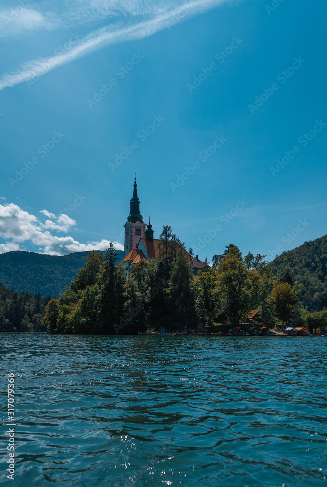 small island with church in the middle of a lake in bled in Slovenia