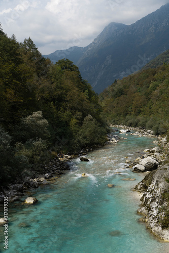 Soca river with mountains in the backround
