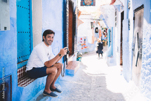 Cheerful young male tourist enjoying sightseeing in Morocco © BullRun