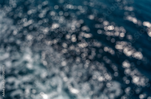 Background shot of aqua sea water surface. Abstract texture of nature. Rapid sea while sailing ship. blurred