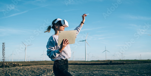 Tableau sur toile Woman creating virtual reality in open space