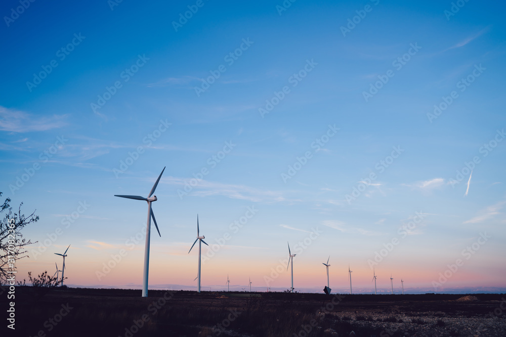Large windmills against a blue sky
