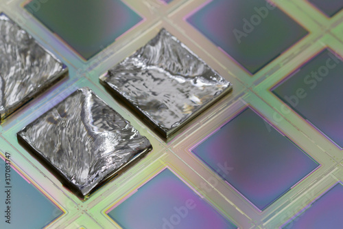 Pieces of polycrystalline silicon integrated on a polysilicon substrate with microchips.