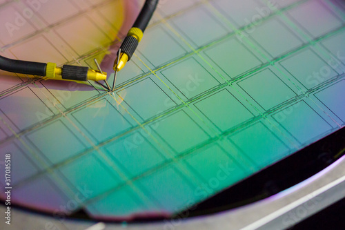 Manual probe system with needles for test of semiconductor on silicon wafer. Selective focus. photo