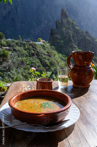 Homemade vegetables soup served with Canarian gofio flour based on local recipe of Masca village, Tenerife, Spain photo