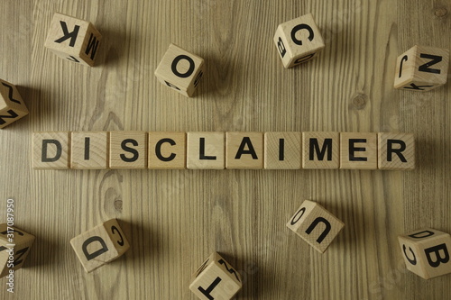 Word disclaimer from wooden blocks photo