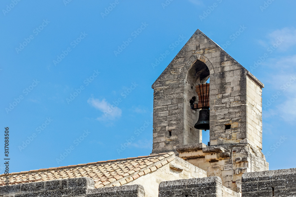 exterior facade of Palais des papes with blue sky in Avignon