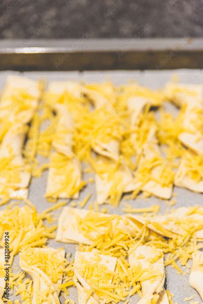 Obraz premium Making cheese stems that just come out of the oven.